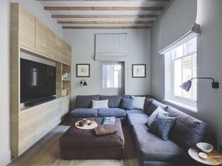 grey small living room with wooden media wall