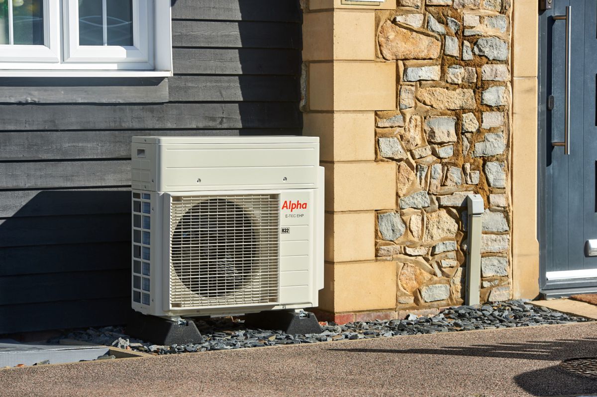 An outside Alpha Boiler against a stone wall