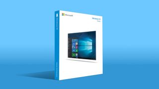 Windows 10 retail box casting a shadow on a blue backdrop