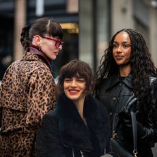a collage of three stylish women wearing dark coats and sunglasses during new york fashion week