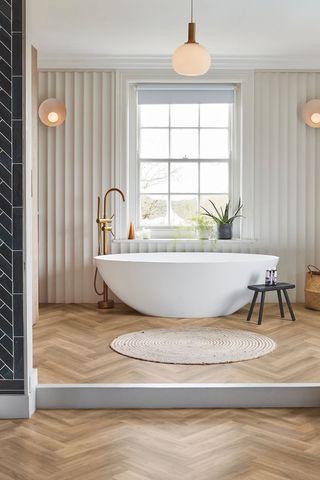bathroom with tub and tiles