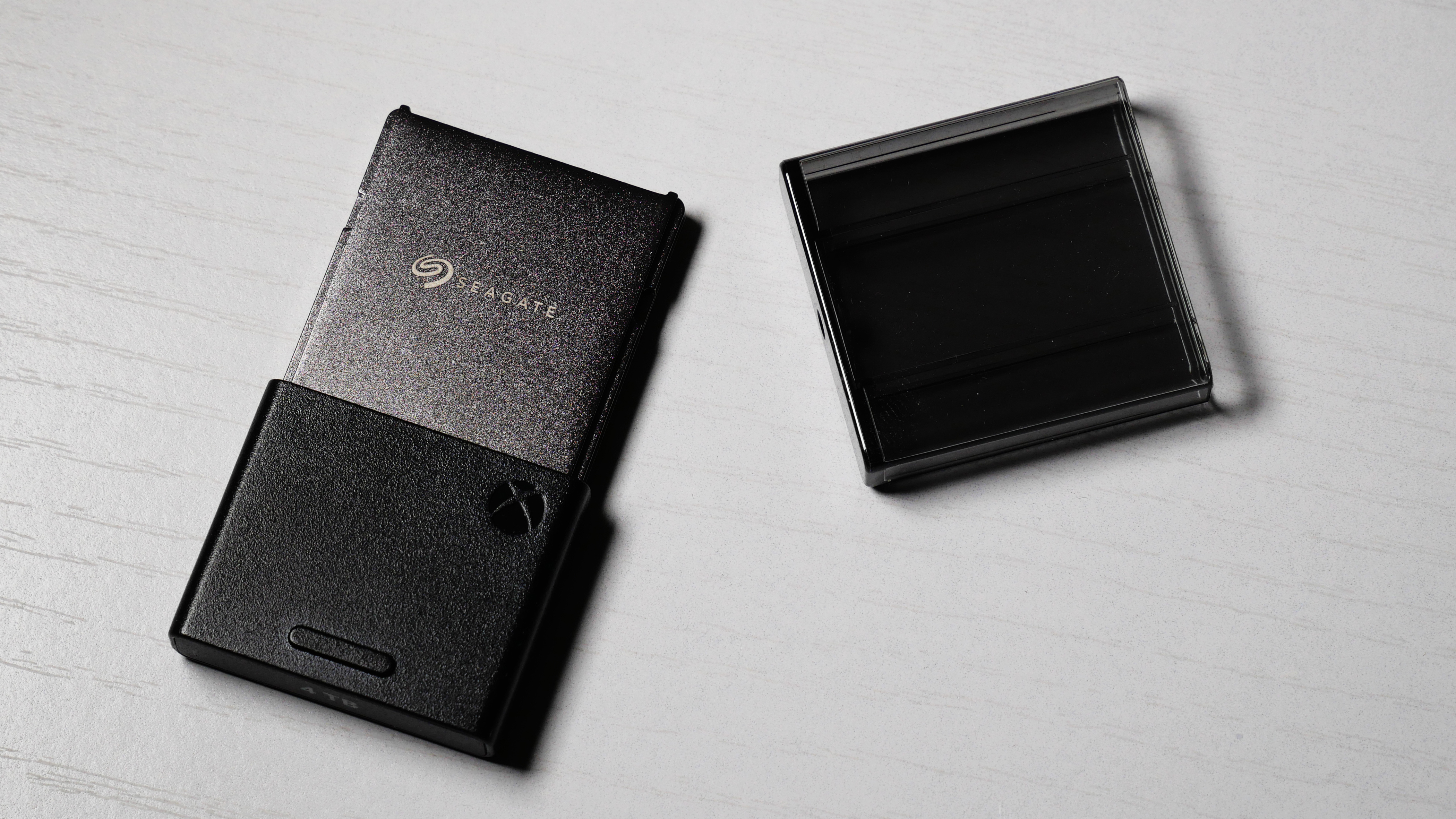 4TB Seagate Storage Expansion Card on a white desk, highlighting its light-and-thin design.