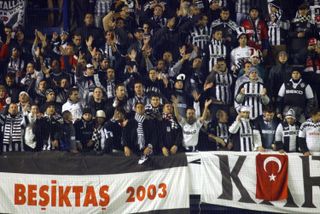 Besiktas fans cheer on their team during a Champions League game against Sparta Prague in October 2003.