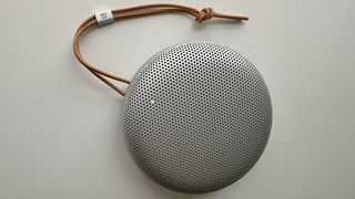 Bang & Olufsen Beosound A1 3rd Generation in silver, on gray table