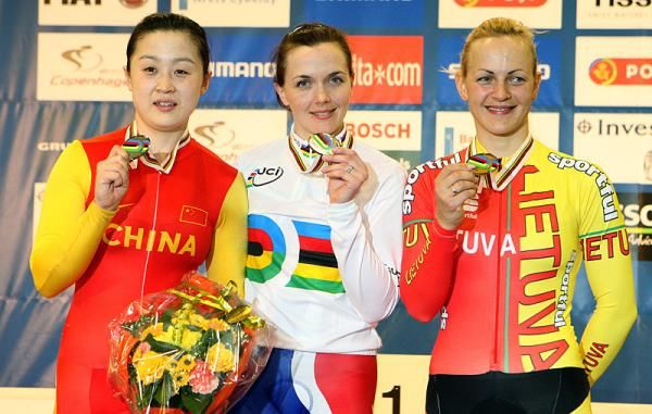 Victoria Pendleton (Great Britain) with her gold medal, flanked by (left) silver medallist Shuang Guo (China) and Simona Krupeckaite (Lithuania) with the bronze.
