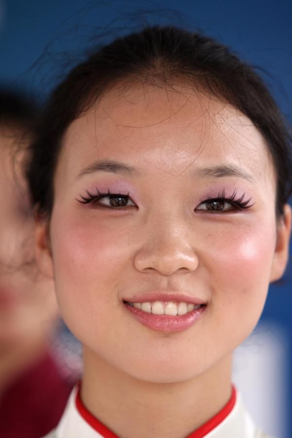 This podium girl seems happy the riders have come to China.
