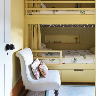 Yellow kids room with built in bunk beds