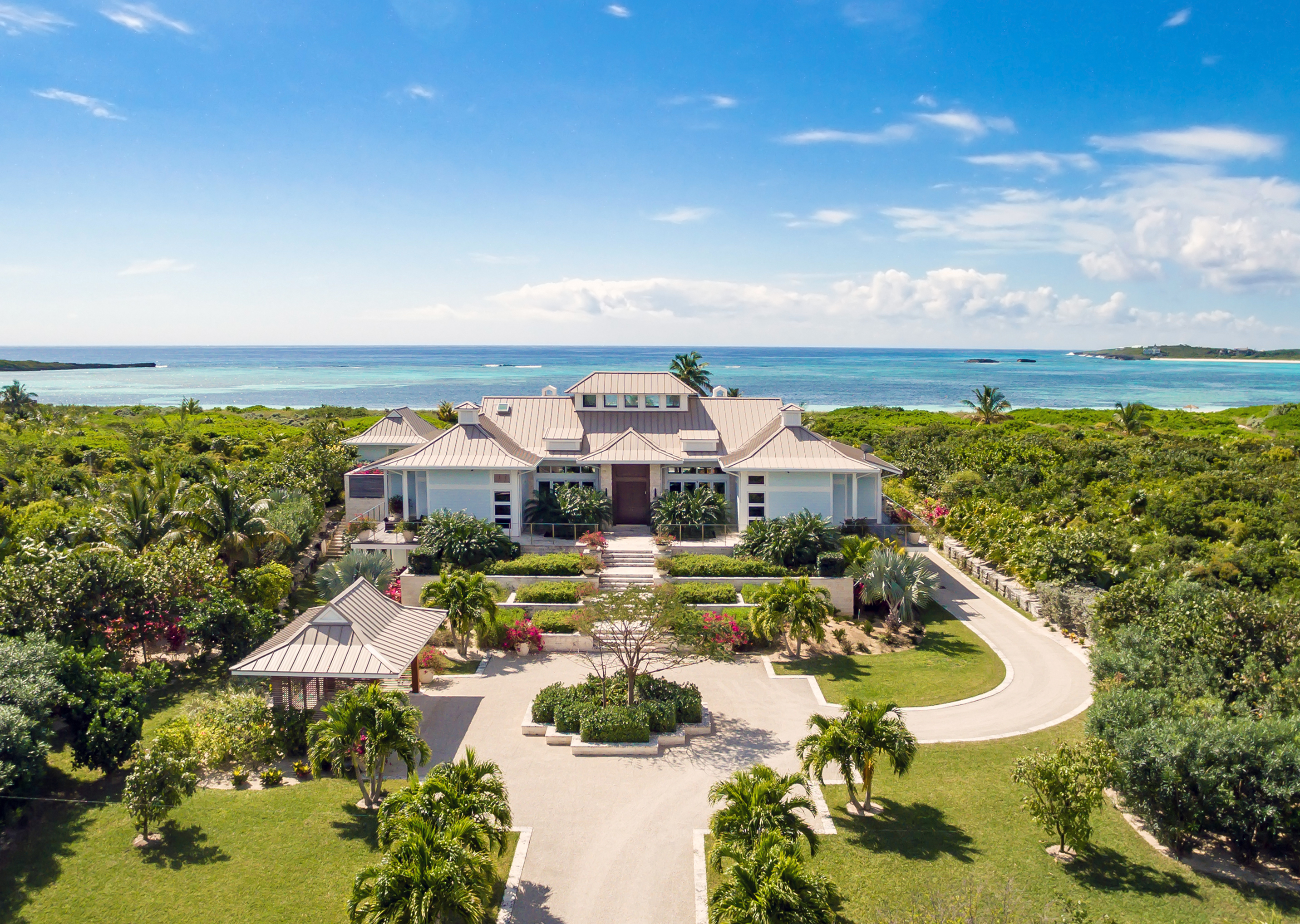A building at The Abaco Club with the ocean in the background.