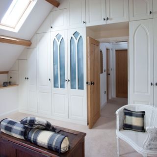 dressing area with wardrobe and wooden door