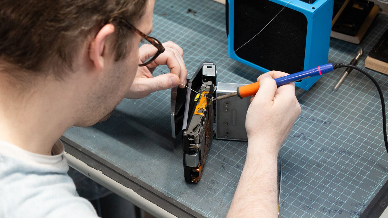 Tear down of the Polaroid SX-70 camera in the Retrospekt workshop during a refurbish