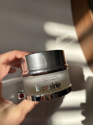 Mica Ricketts holding pot of La Prairie Cellular 3-Minute Peel