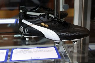 A Puma King soccer cleat signed by soccer player Pele is displayed at the Julien's Auctions press call for Music Icons And Sports Legends Memorabilia Auction at Julien's Auctions Gallery on June 18, 2012 in Beverly Hills, California.