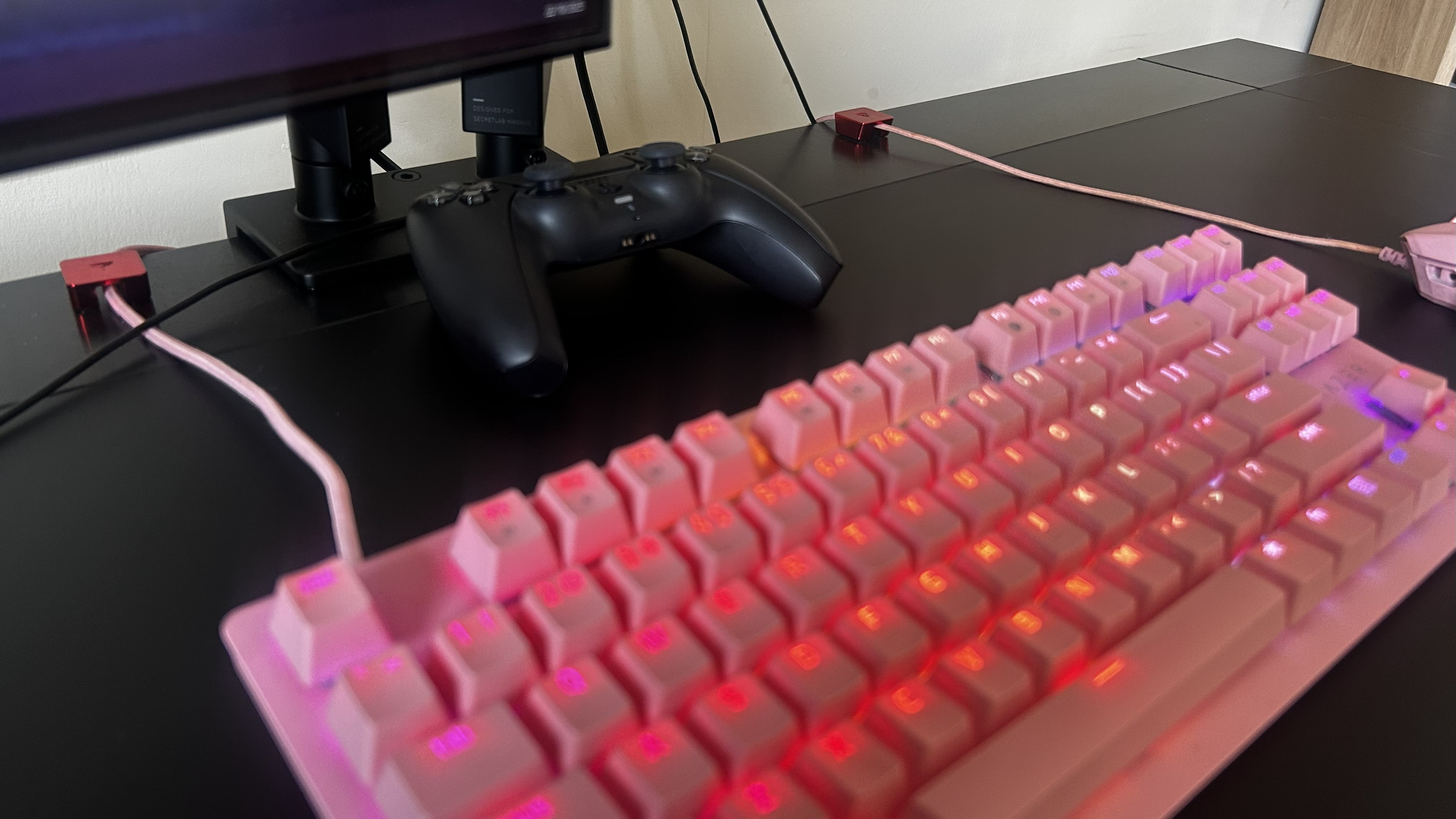A closeup of the Secretlab Magnus Evo desk showcasing the metal back portion with cable anchors.