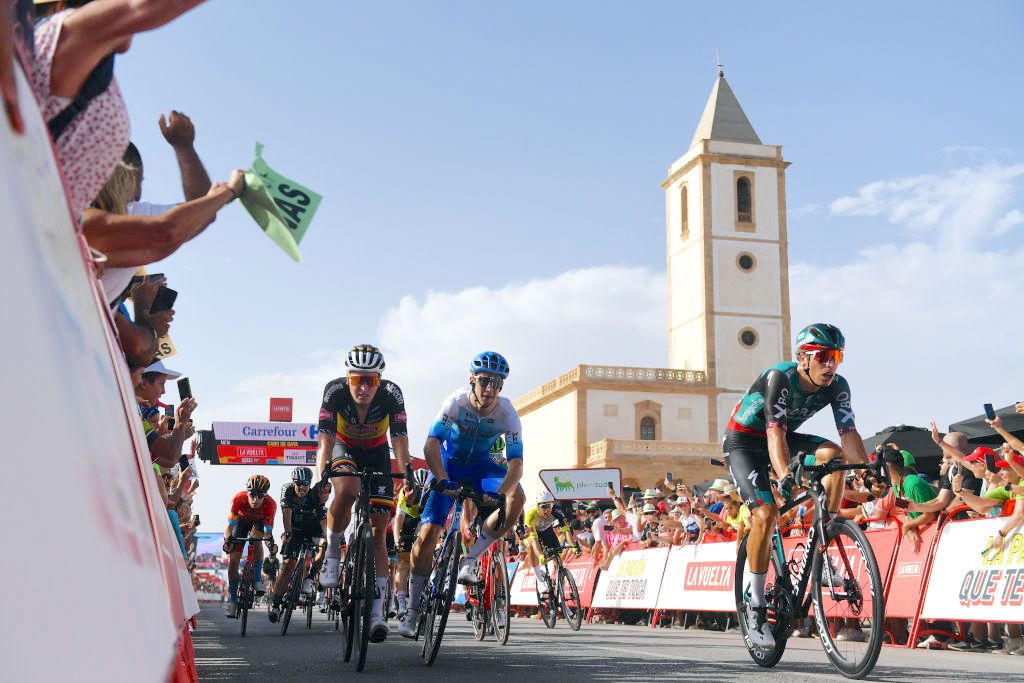 CABO DE GATA, SPAIN - AUGUST 31: Kaden Groves of Australia and Team BikeExchange - Jayco celebrates winning ahead of Danny Van Poppel of Netherlands and Team Bora - Hansgrohe and Tim Merlier of Belgium and Team Alpecin-Deceuninck during the 77th Tour of Spain 2022, Stage 11 a 191,2km stage from ElPozo Alimentaci&Atilde;&sup3;n - Alhama de Murcia to Cabo de Gata / #LaVuelta22 / #WorldTour / on August 31, 2022 in Cabo de Gata, Spain. (Photo by Tim de Waele/Getty Images)