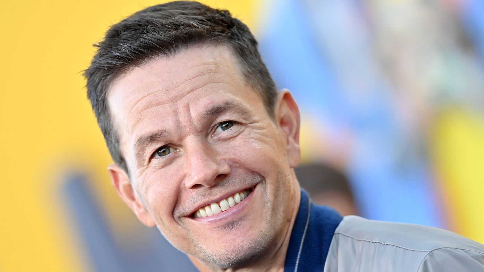 mark wahlberg on a yellow background