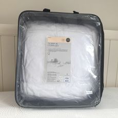 Next White Sleep In Comfort Dual Layer Mattress Topper being tested on a bed at home