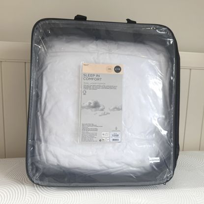 Next White Sleep In Comfort Dual Layer Mattress Topper being tested on a bed at home