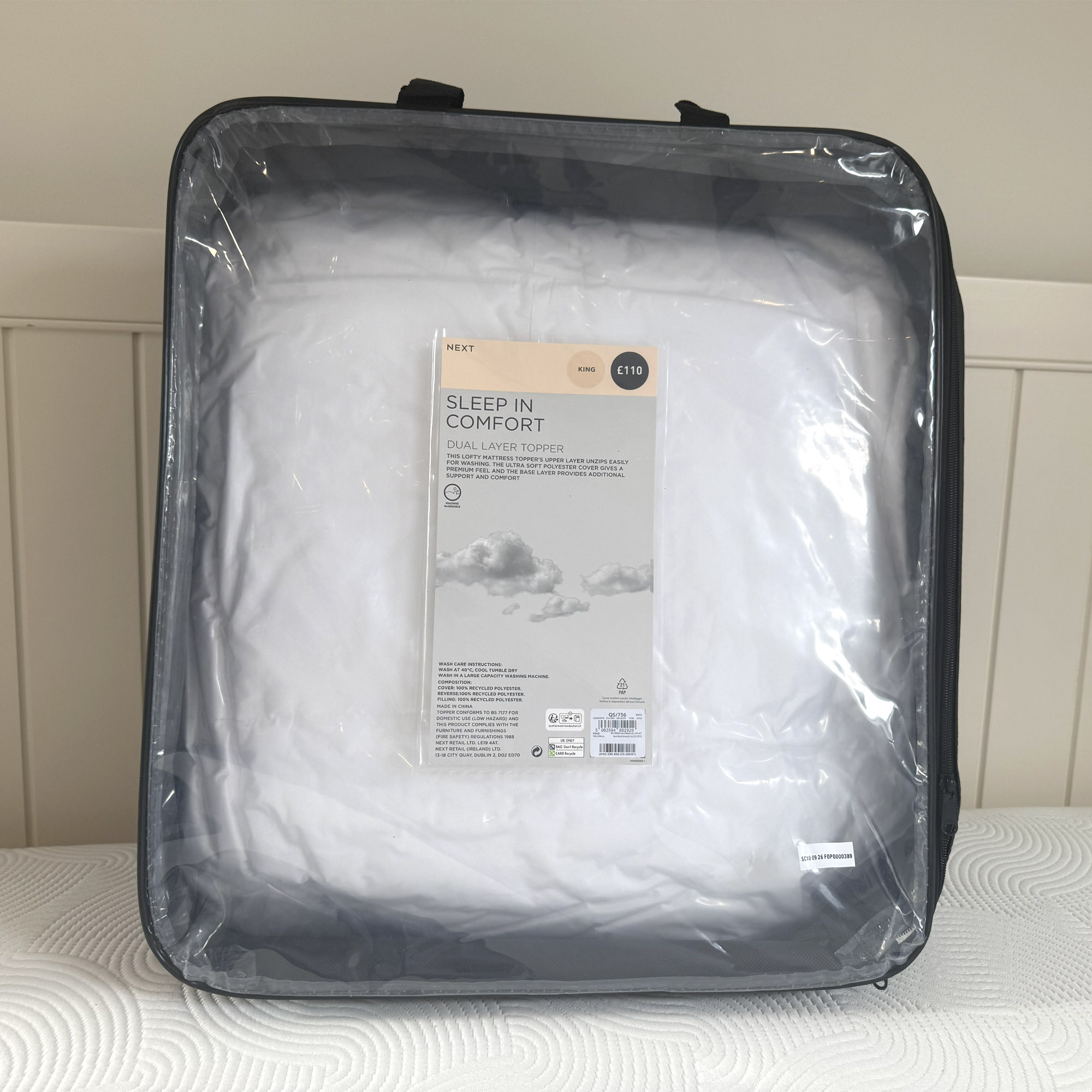 Next White Sleep In Comfort Dual Layer Mattress Topper being tested on a bed at home