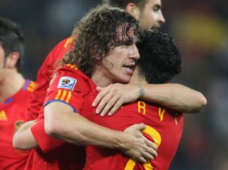 Carles Puyol hugs Xavi after scoring for Spain against Germany in the 2010 World Cup semi-final.