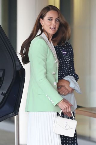 Catherine, Princess of Wales carries a white handbag as she attends day two of the Wimbledon Tennis Championships at All England Lawn Tennis and Croquet Club at All England Lawn Tennis and Croquet Club on July 04, 2023 in London, England.