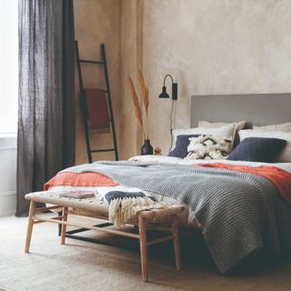Bedroom with a bed and hanging ladder