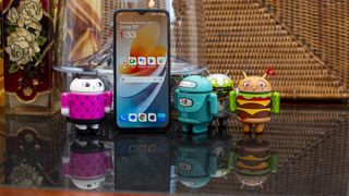 OnePlus Nord N300 5G posing with Android figurines