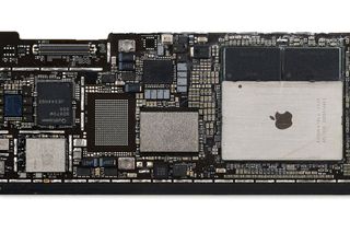 iFixit teardown showing the M4 chip and RAM modules on the iPad Pro 13.