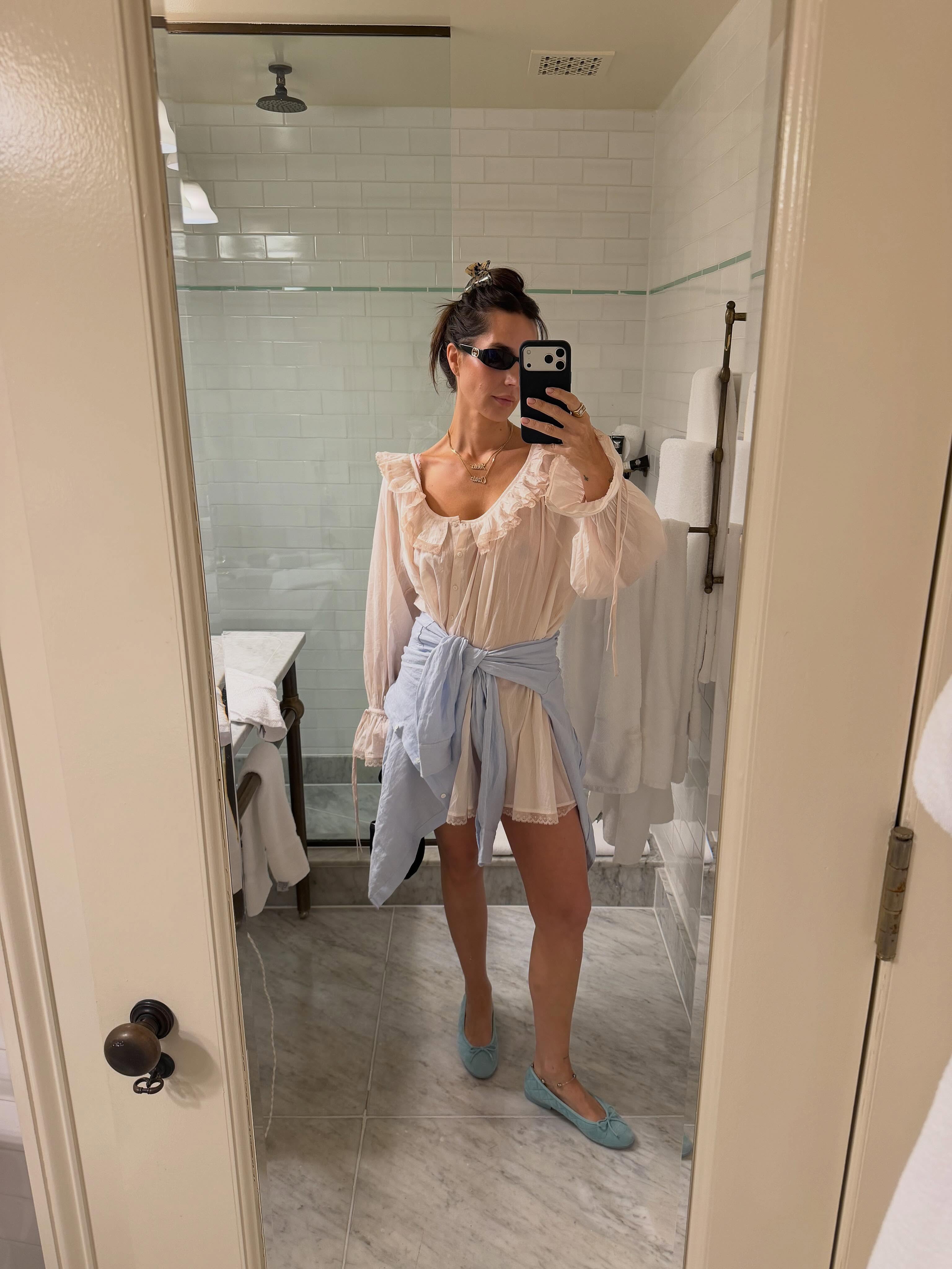 Pia Baroncini in a white LPA dress and blue Chanel flats.