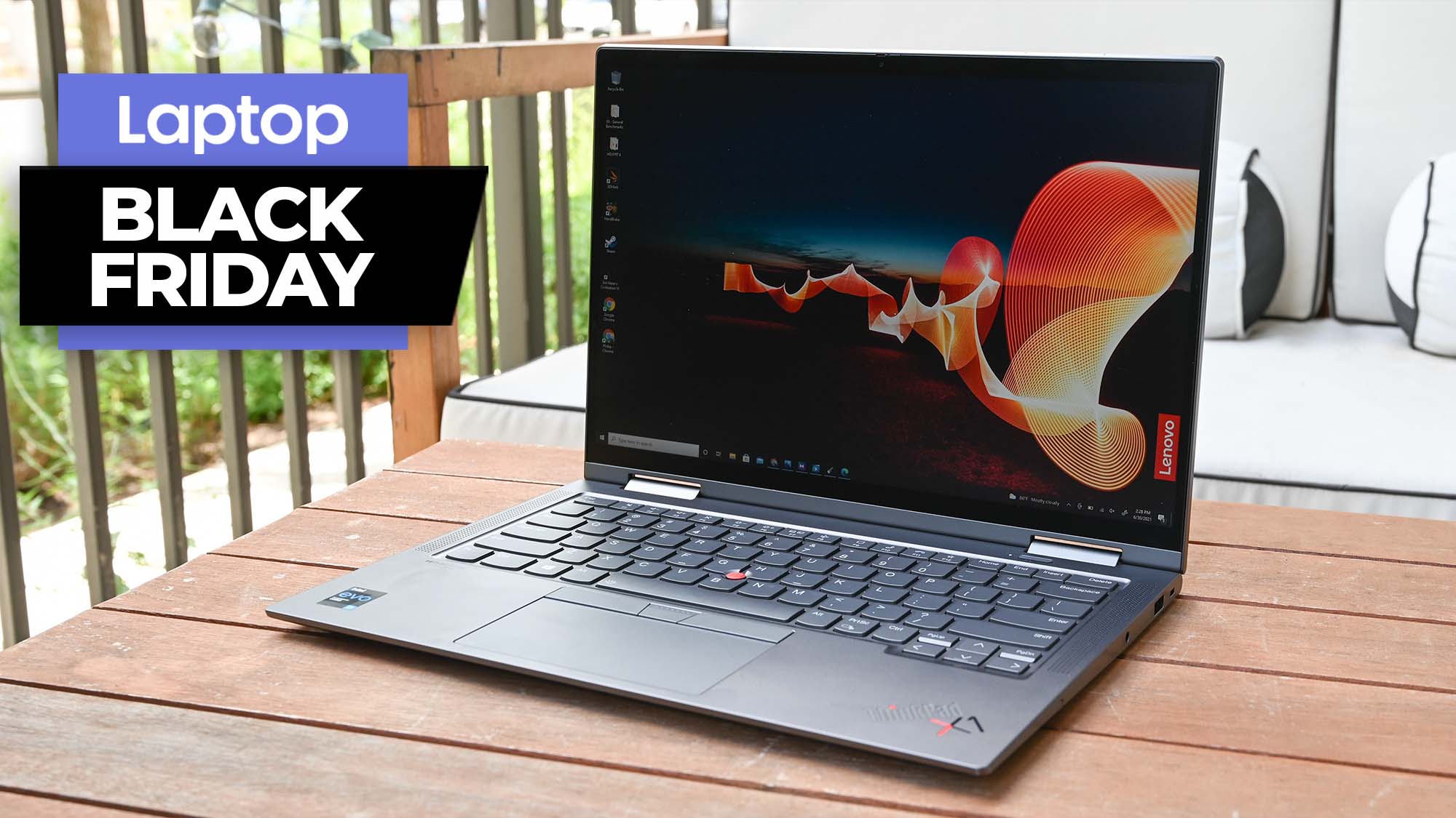 Lenovo ThinkPad X1 Yoga Gen 6 on a coffee table outside with a Black Friday Laptop banner to the upper-left