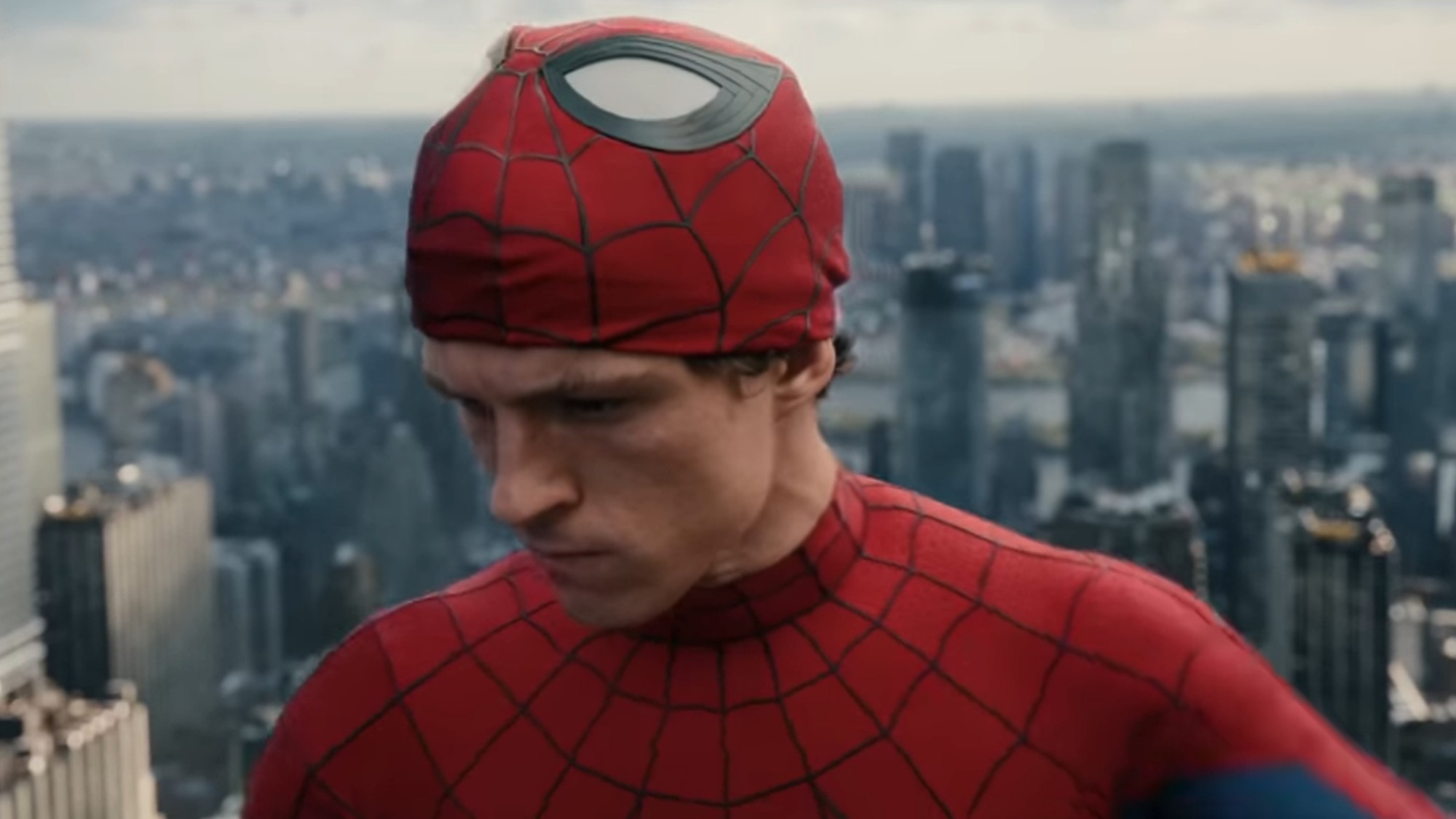 Tom Holland looking down in Spider-Man: Brand New Day.