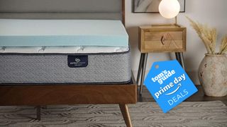 The image show the 3&quot; Serta mattress topper on a Serta mattress with a TRom&#039;s Guide Amazon Prime Day deal badge on top 