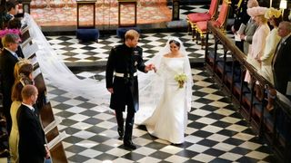 Prince Harry, Duke of Sussex and The Duchess of Sussex leave following their wedding ceremony