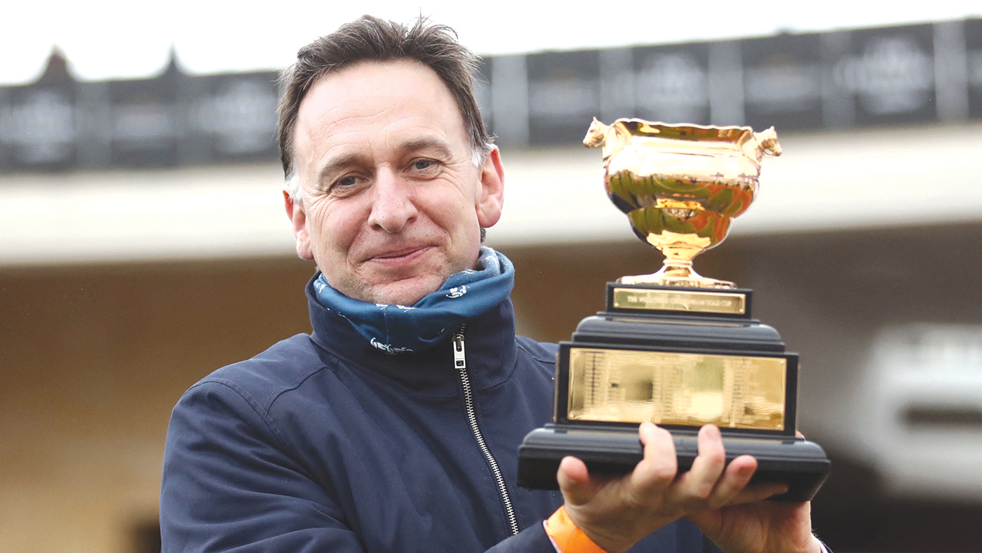 Trainer Henry de Bromhead poses with the Gold Cup after winning the Cheltenham Gold Cup Chase with Minella Indo on day four of the Cheltenham Festival at Cheltenham Racecourse on March 19, 2021 in Cheltenham. (Photo by - / POOL / AFP) (Photo by -/POOL/AFP via Getty Images)