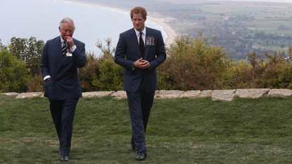 Prince Harry chats with Prince Charles, Prince of Wales