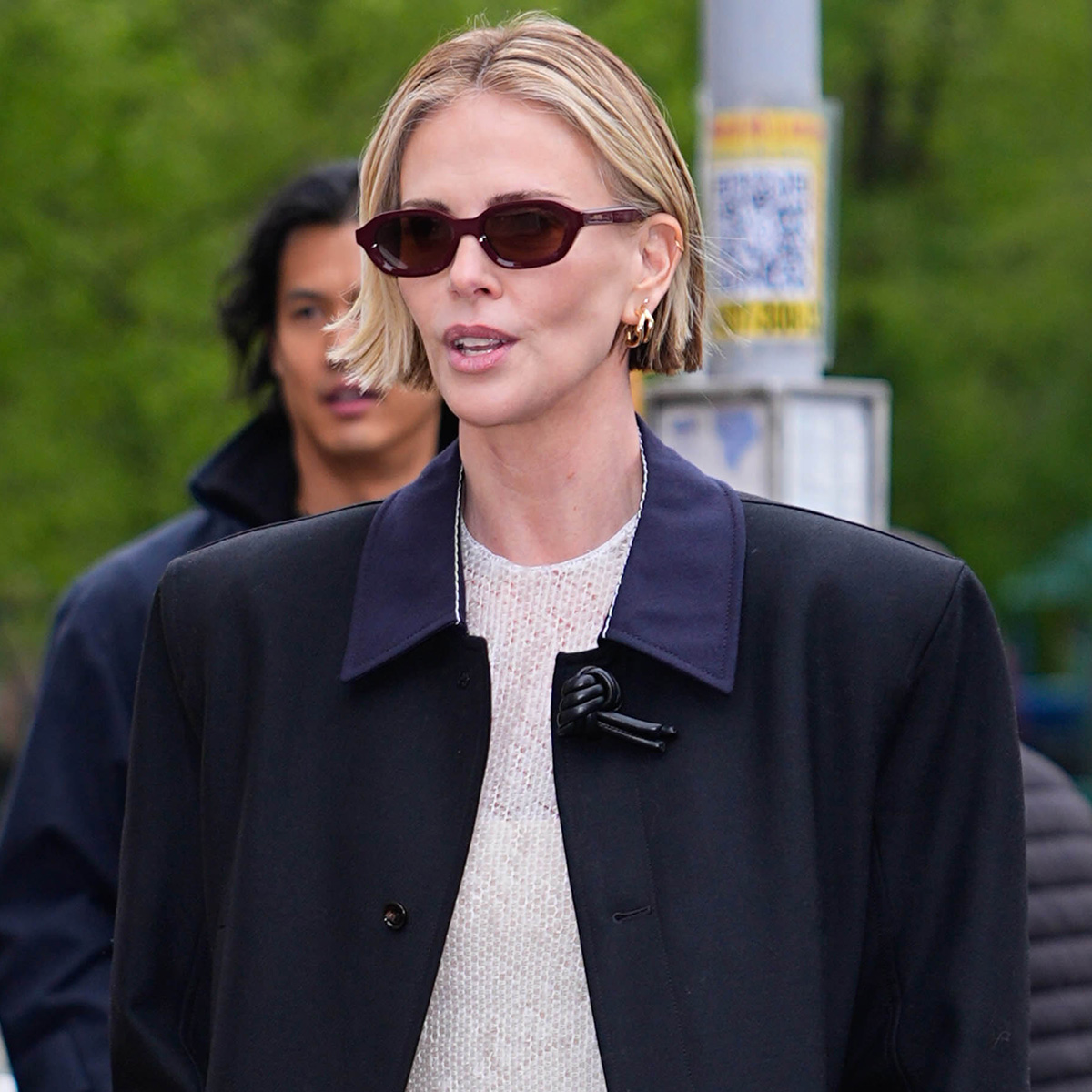 NEW YORK, NY - APRIL 22: Kareem Rahma and Charlize Theron are seen on April 22, 2026 in New York City. 
