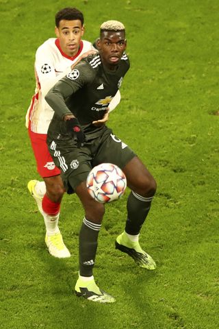 Pogba’s (right) leap and header forced United’s second late on at Leipzig