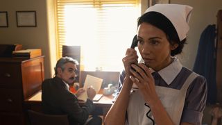 Kate (Michelle Keegan on the phone in uniform in Ten Pound Poms