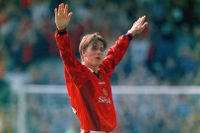 David Beckham celebrates his goal from the halfway line for Manchester United against Wimbledon in August 1996.