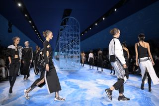 models on the Dior 2025 spring runway carrying the dior d journey bag