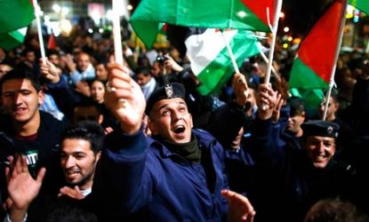 Palestinians celebrate the U.N.'s upgrade on Thursday of the Palestinian Authority's status to non-member state.