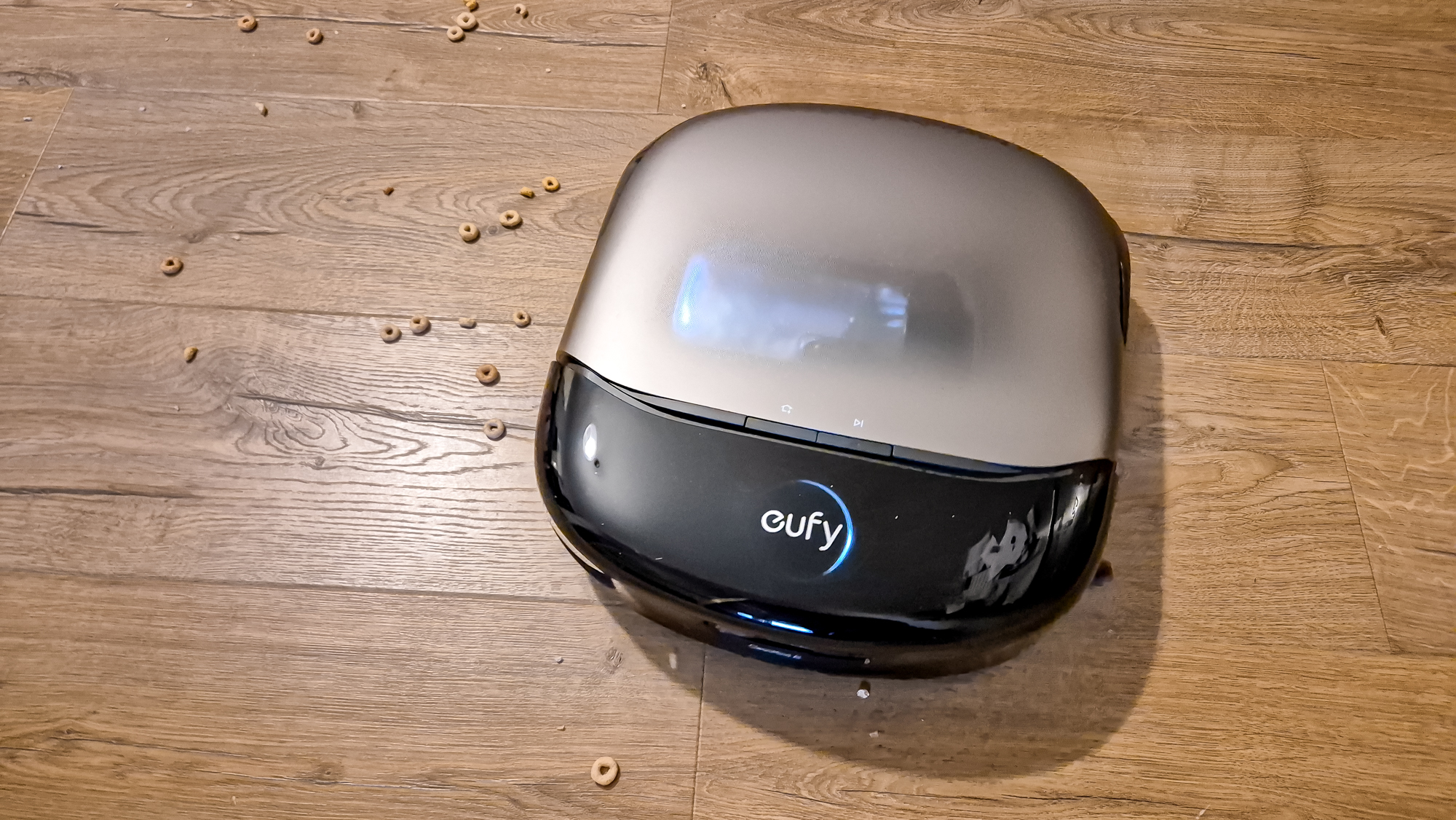 Eufy Omni S2 cleaning cheerios on wooden floor