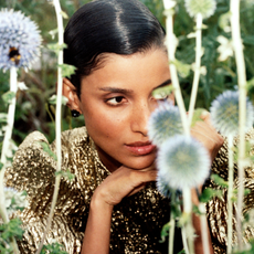 model in field with flowers