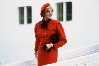 Diana, Princess of Wales wears a charm bracelet aboard the new P&O cruise liner "Royal Princess", named in honour of her