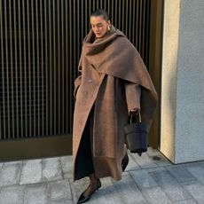 @sobalera wearing a brown scarf coat