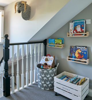 Carpeted landing with toy storage boxes