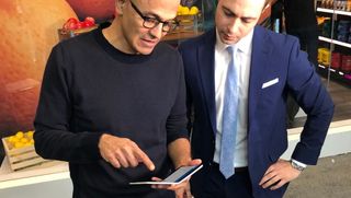 Microsoft CEO Satya Nadella showing off Surface Duo