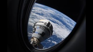 a cone-shaped spacecraft is visible through the window of a space station. behind the spacecraft is cloudy earth and the black of space