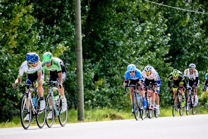 Riders fight hard at the front to cause a split