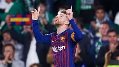Barcelona captain Lionel Messi celebrates his hat-trick goal against Real Betis