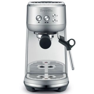 The Breville Bambino in stainless steel on a white background